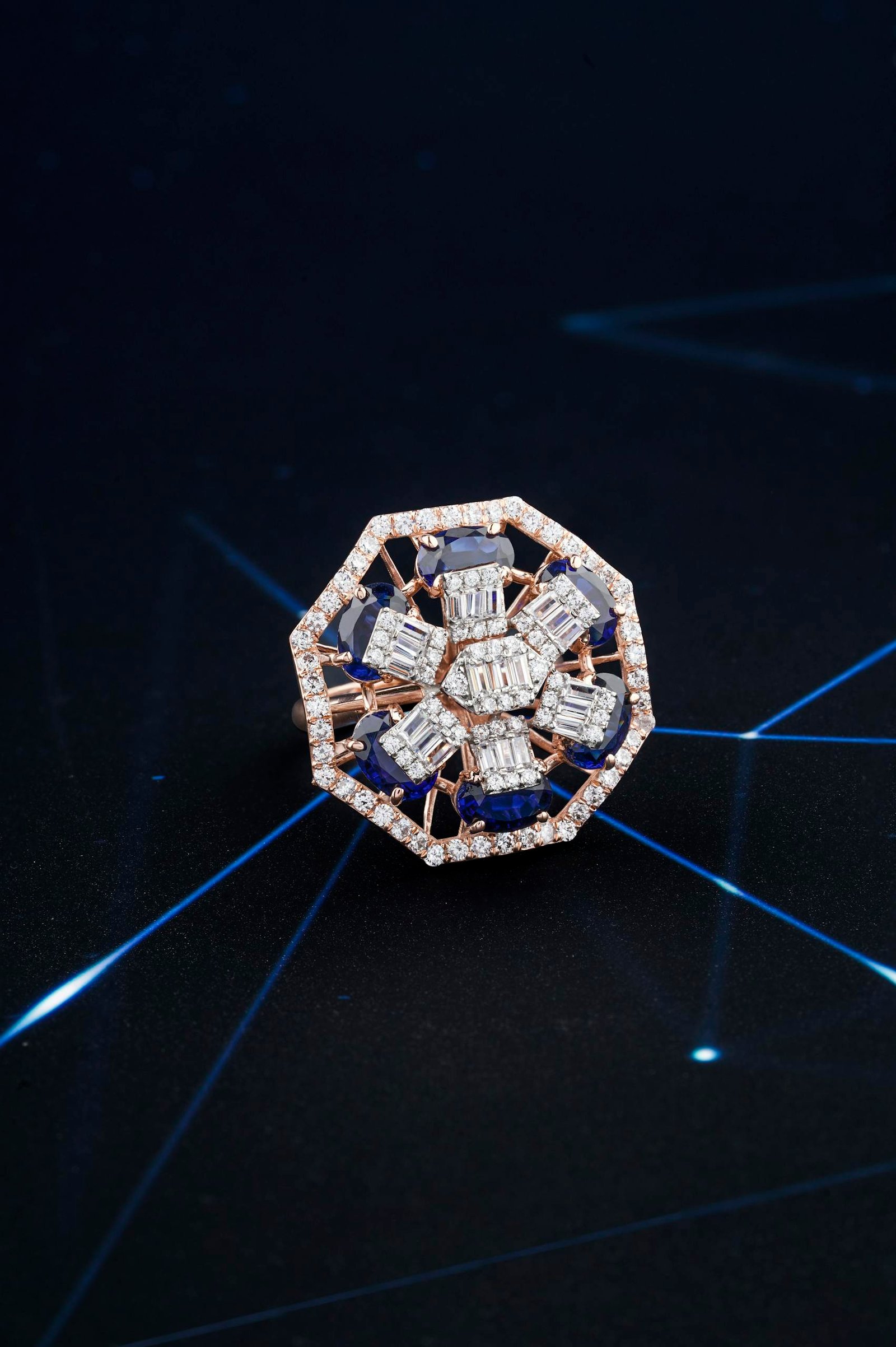 Close-Up Shot of a Diamond Ring on Blue Surface
